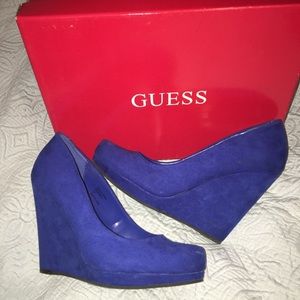 Size 7 royal blue Guess wedges.